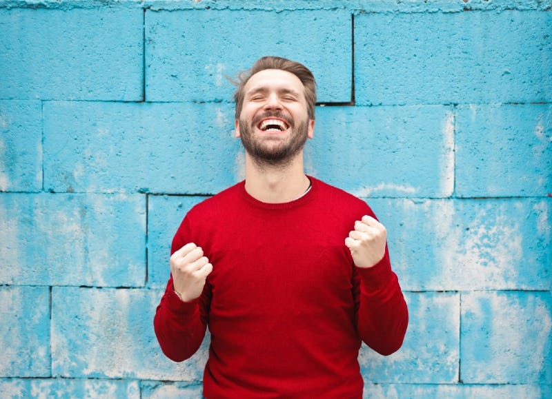 Happy man in a red shirt