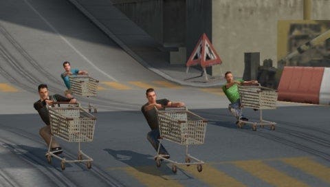Four guys riding abandoned shopping carts down a city street