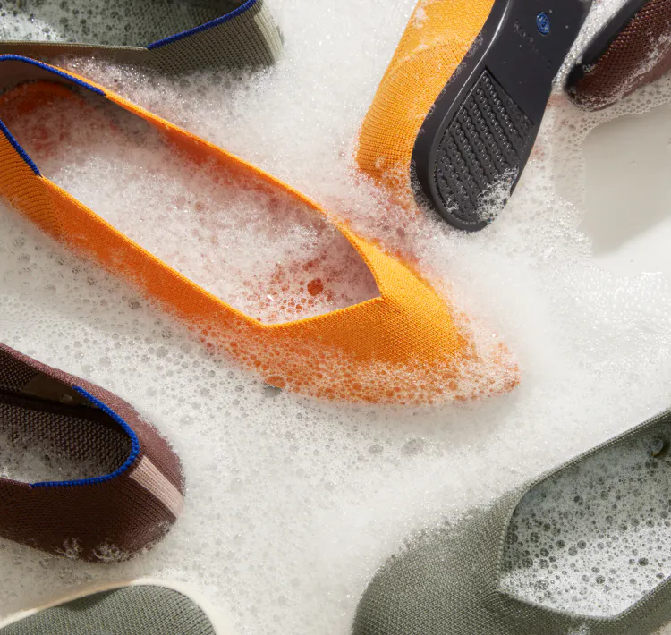 The Point in Saffron, The Flat in Thyme and The Loafer in Chocolate shown in sudsy water. 