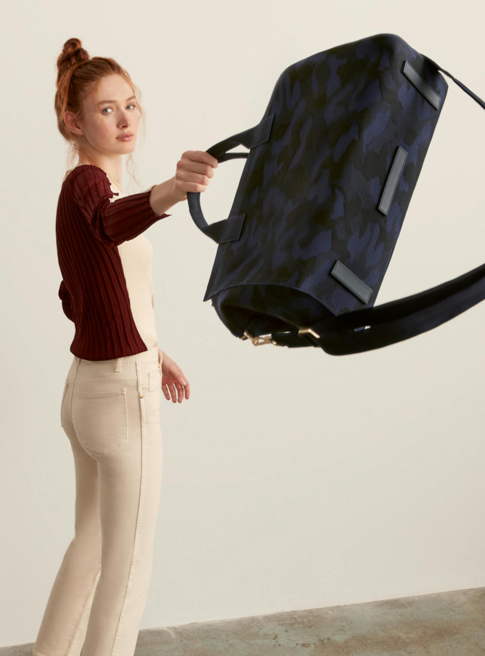 The Overnighter and The Weekender in Midnight Camo shown with a model.