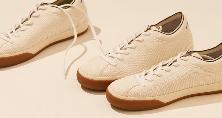 Close up of a few pairs of The Lace Up in Vanilla, shown in diagonal view.