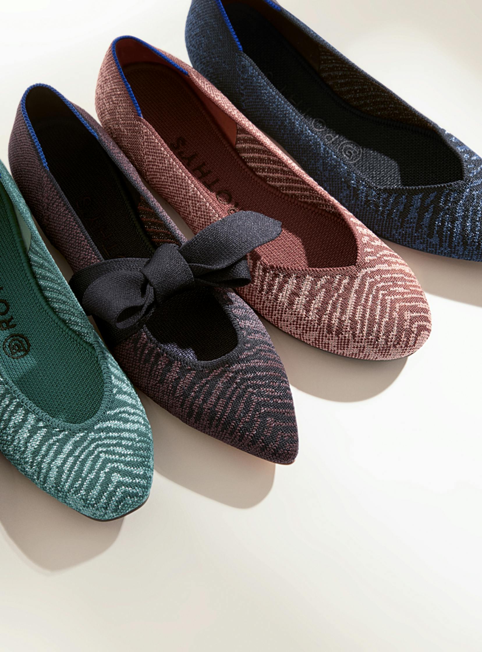 The Loafer in Twilight Metallic, The Square in Mirage Metallic, The Mary Jane in Twilight Metallic, The Flat in Desert Metallic and The Point in Midnight Metallic shown from left to right.