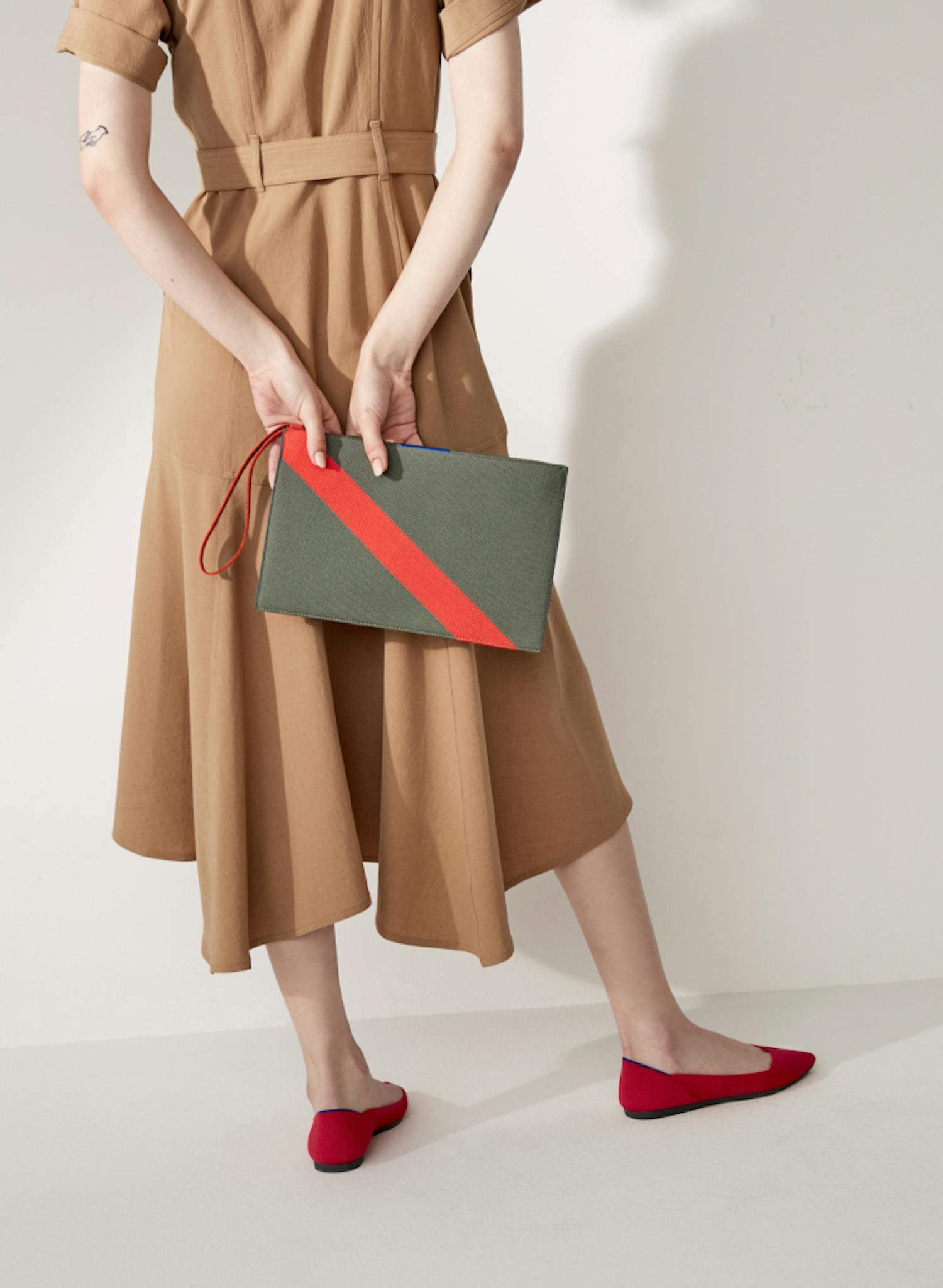 The Essential Pouch and The Essential Tote shown on-model.