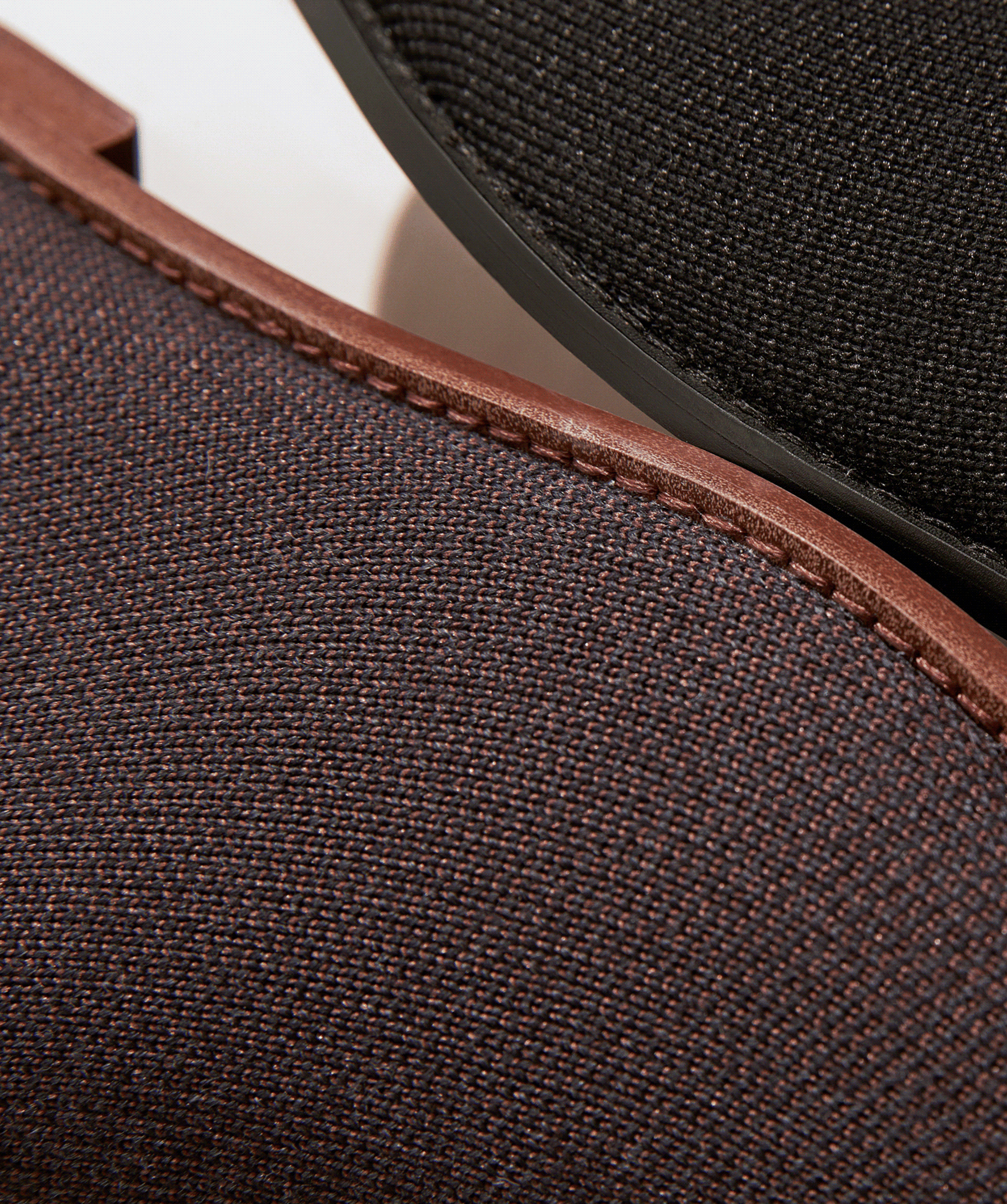 From left to right, close up of knit details of The Merino Ankle Boot in Cocoa Brown and Onyx black, The Merino Ankle Boot in Cocoa Brown shown in diagonal view.