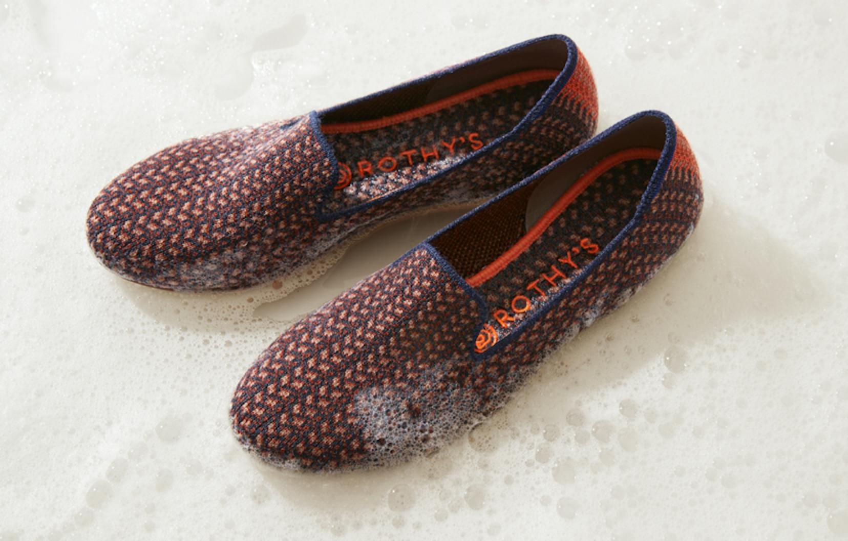Close up of The Merino Loafer in Walnut Tweet, shown standing in soapy water.