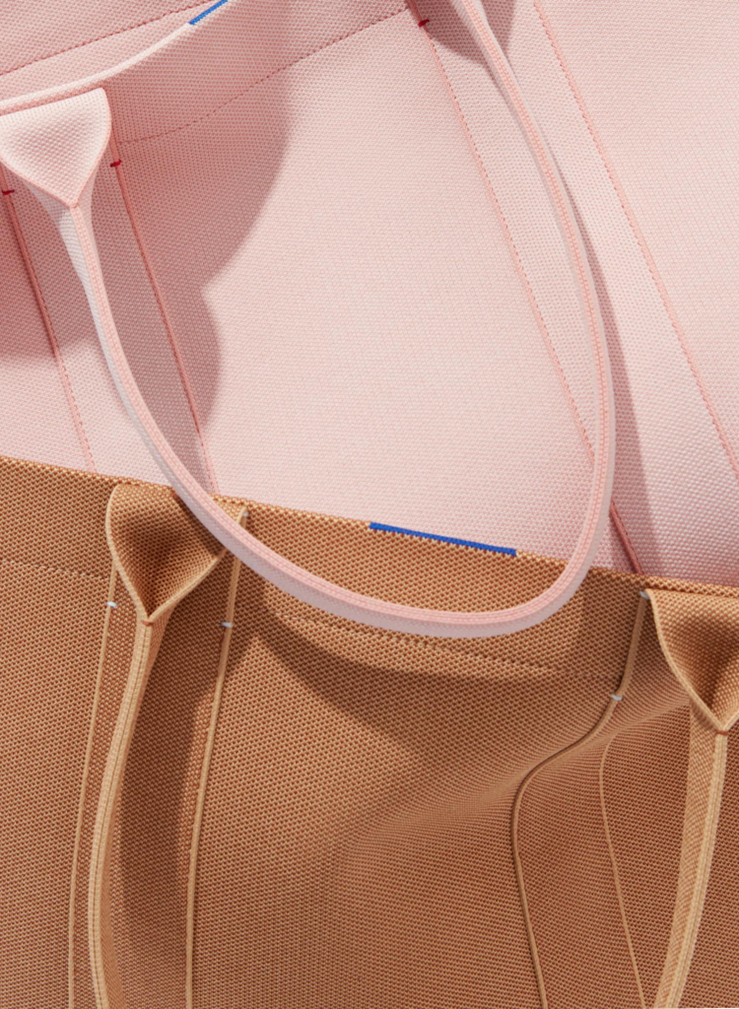 Close up image of The Essential Tote in Rose Water and The Essential Tote in Sienna Brown.