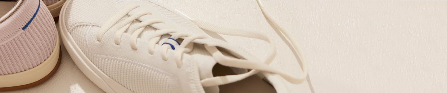 The heel of The Lace Up in Lilac and The Lace Up in Bright White shown from the top.