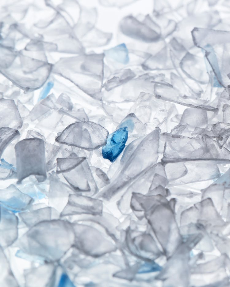 Single-use plastic bottles are chipped into little flakes.
