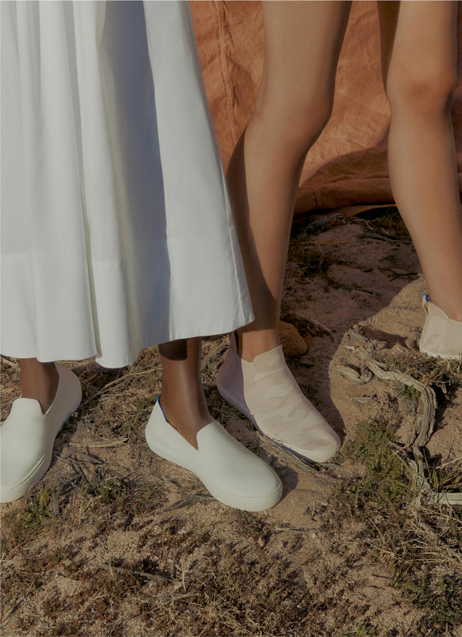 The Sneaker in Bright White and The Chelsea in Sand Camo on model.