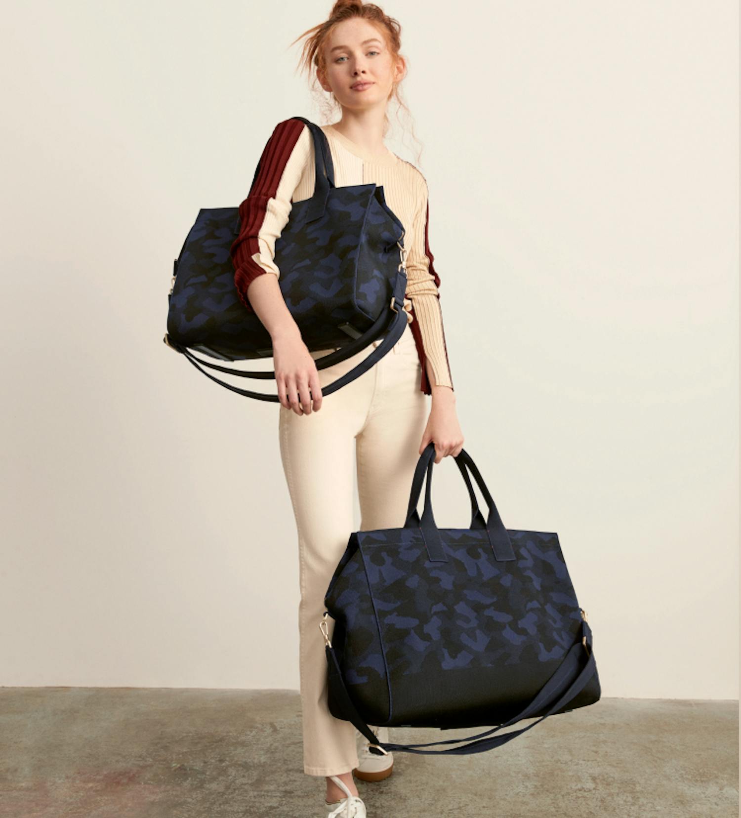The Essential Pouch in Deep Sapphire, The Essential Pouch in Ruby Red and The Essential Pouch in Ink & Ivory shown side by side.