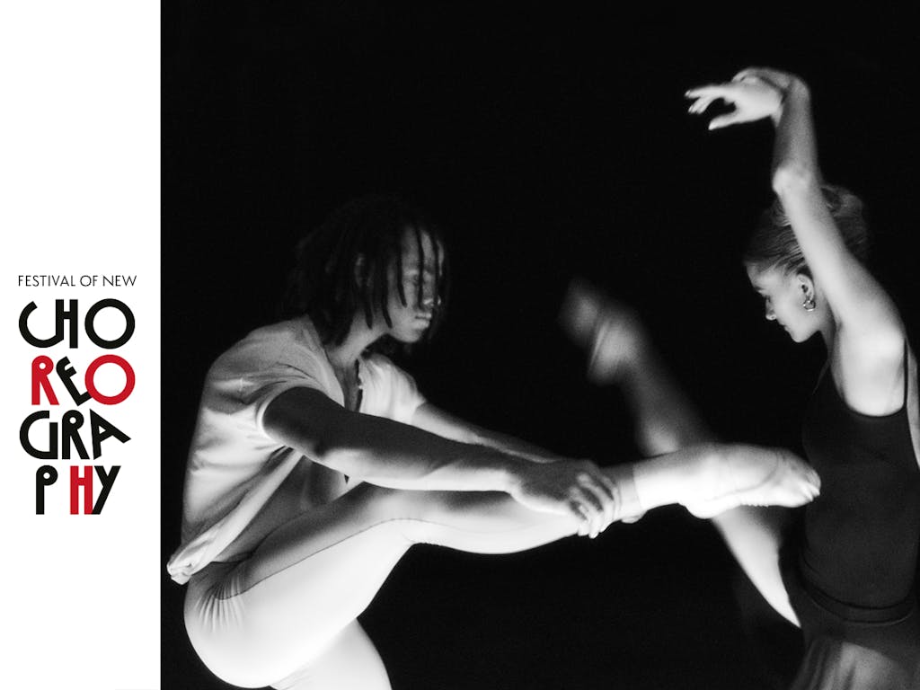 A ballet dancer wearing all white with braids covering his face raises his leg, facing another dancer. The second ballet dancer is blonde and wearing an all black leotard, her arms are raised above her head. The image is in black and white and slightly blurred. A logo to the left of the image reads 'Festival of New Choreography'.