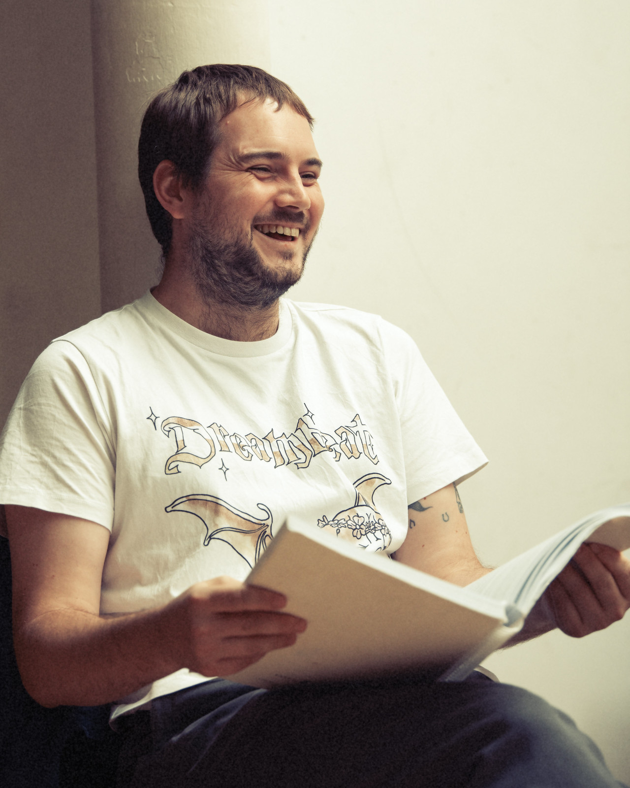 Composer Oliver Leith laughing during a rehearsal.
