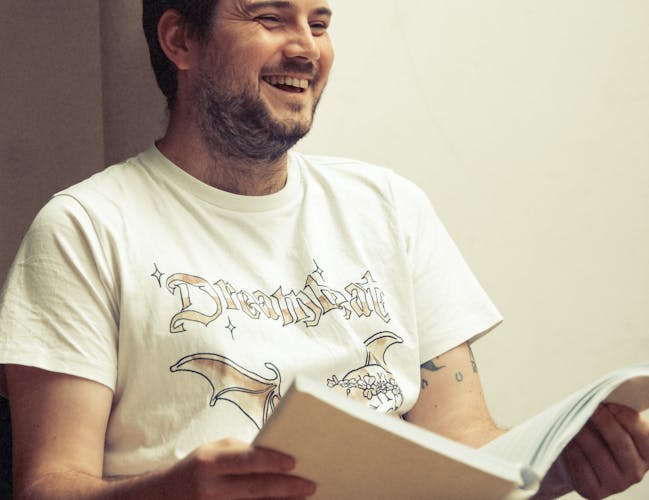 Composer Oliver Leith laughing during a rehearsal.