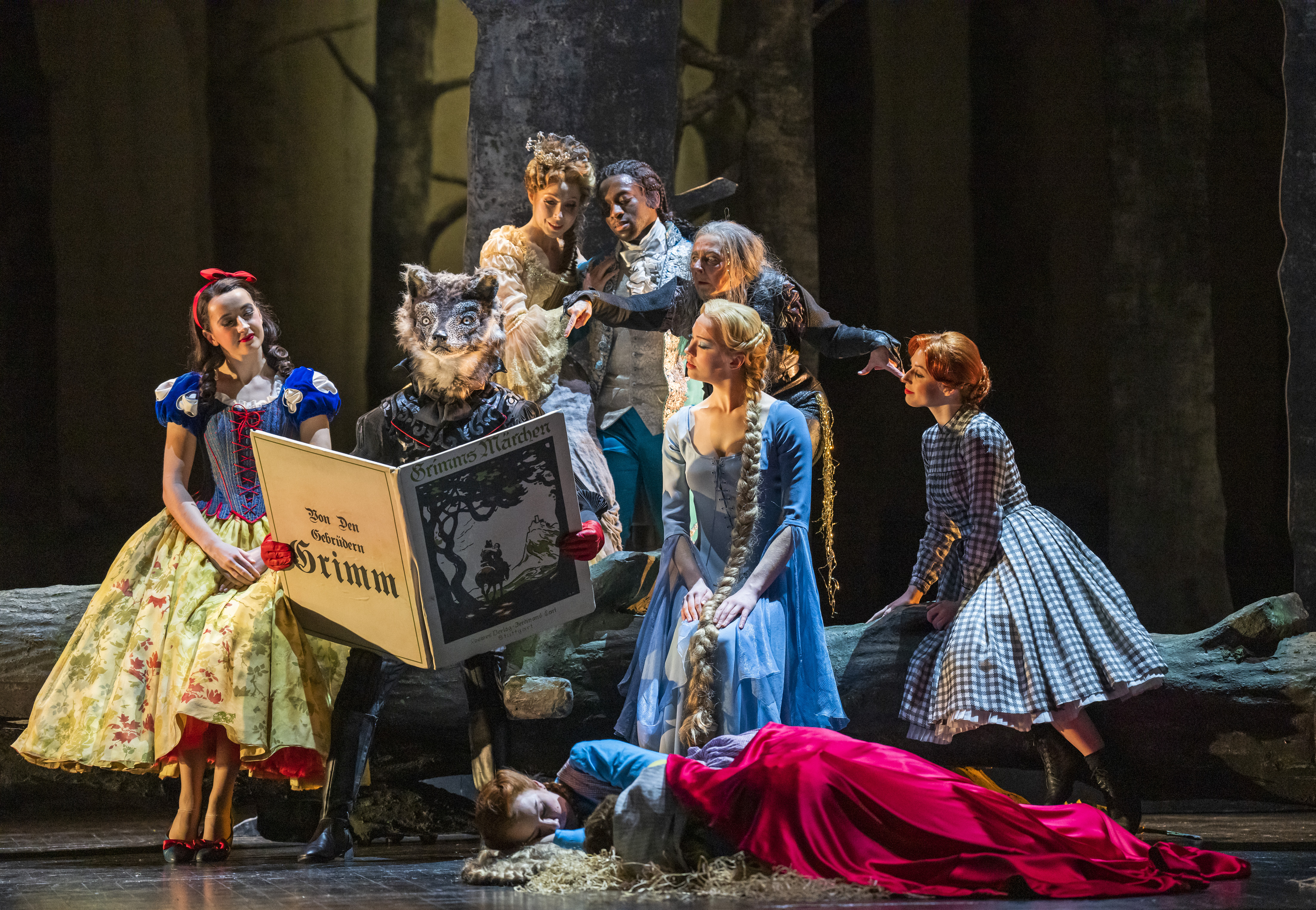 A production of Hansel and Gretel performed by The Royal Opera. As Hansel and Gretel are asleep on the forest floor, a group of fantastical characters inspired by fairy tales, including Snow White and Rapunzel, sit on a felled tree and read from a Brother's Grimm storybook.