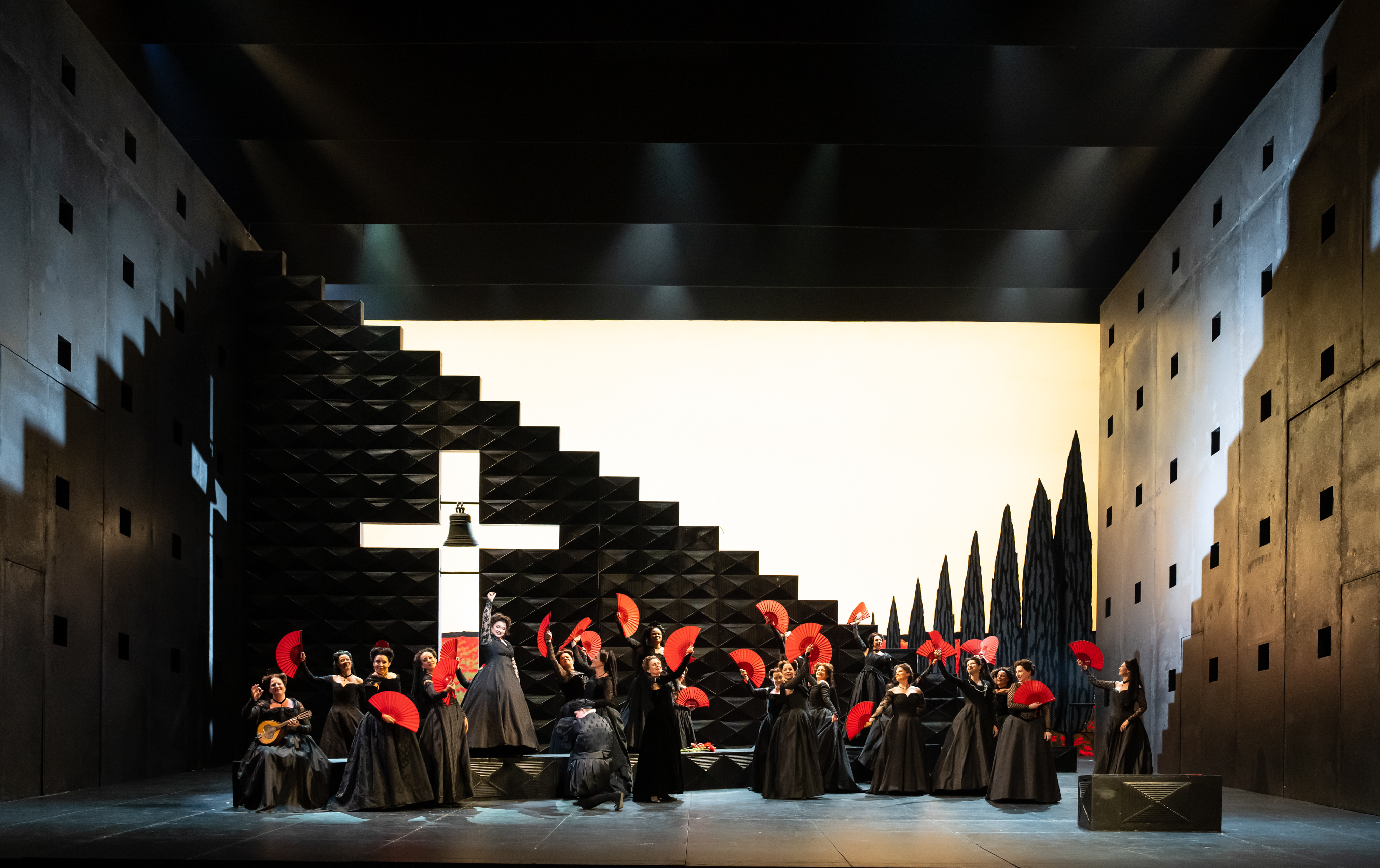 The cast of The Royal Opera production of Don Carlo performing onstage.