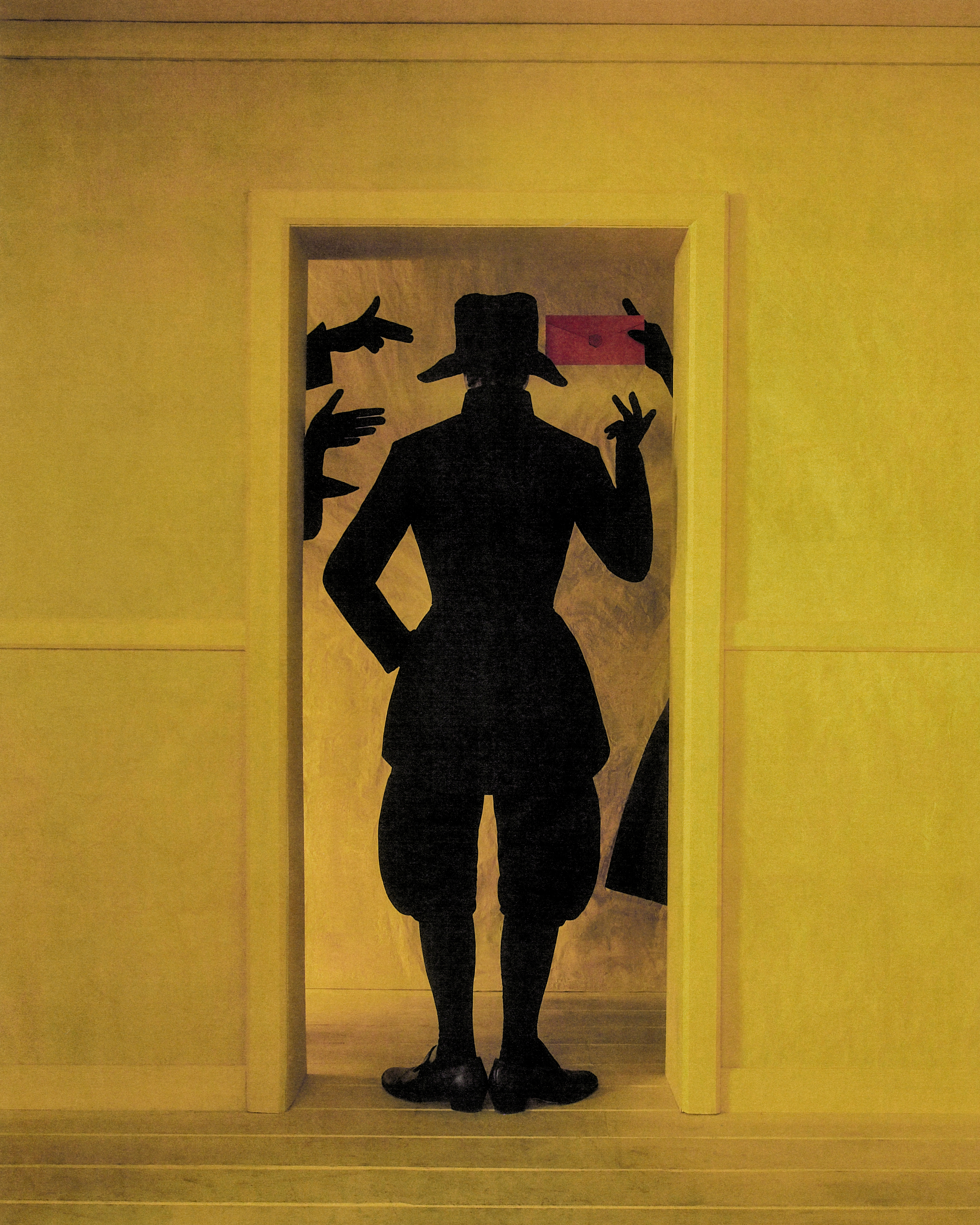 Dark figures appear as shadows in a yellow room. One of them holds a red envelope containing an invite. (4 of 4)