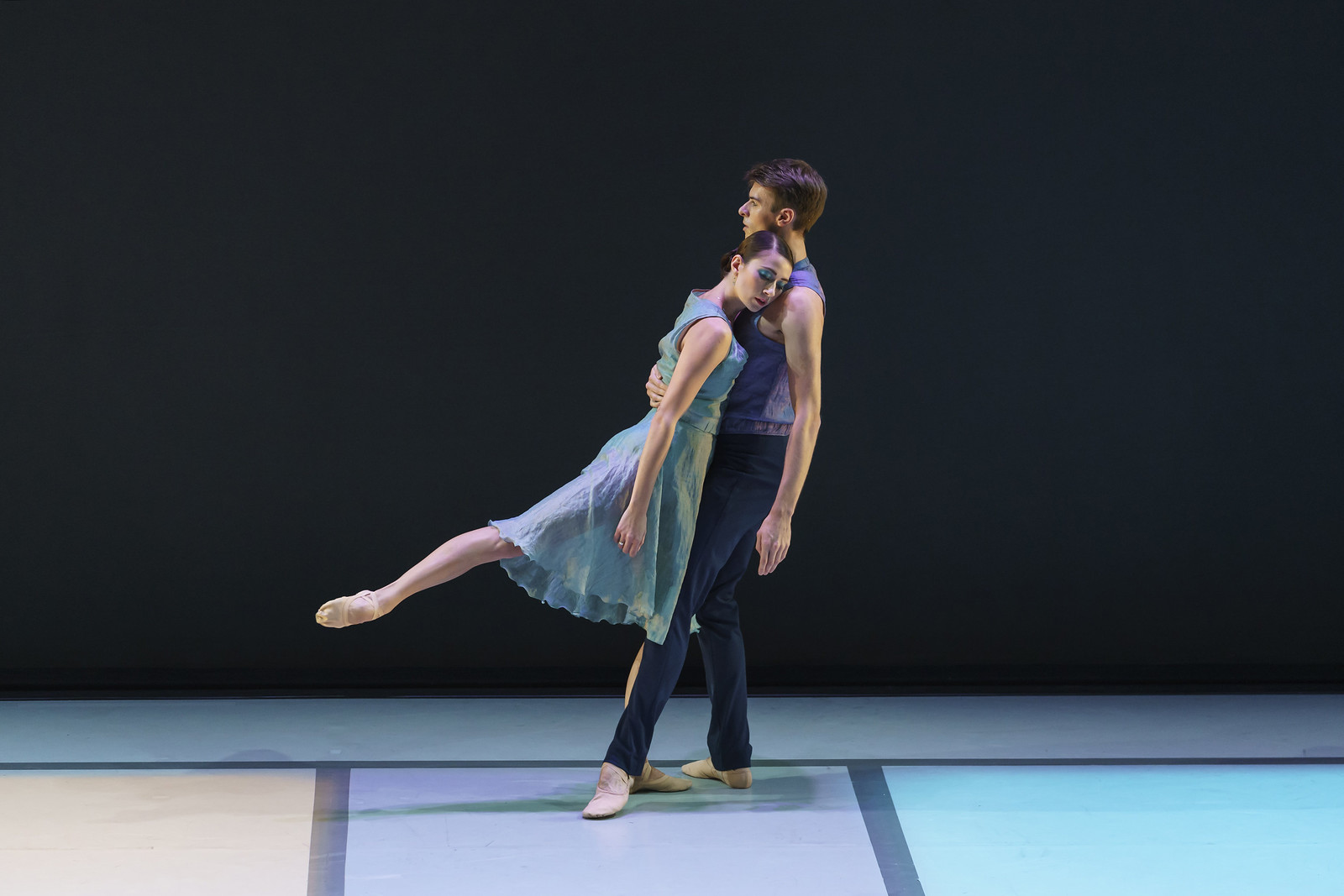 Two ballet dancer performing onstage.