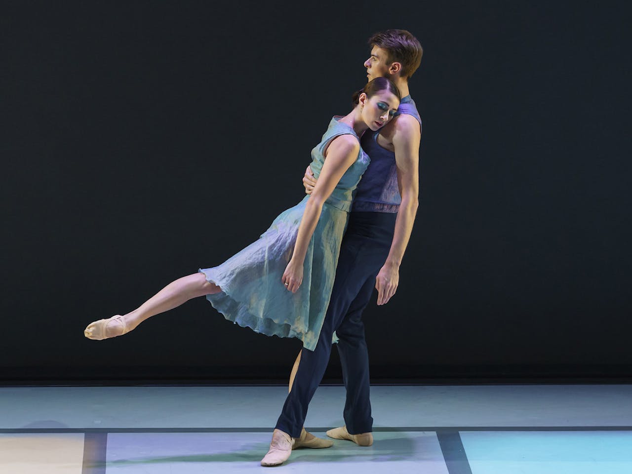 Two ballet dancer performing onstage.