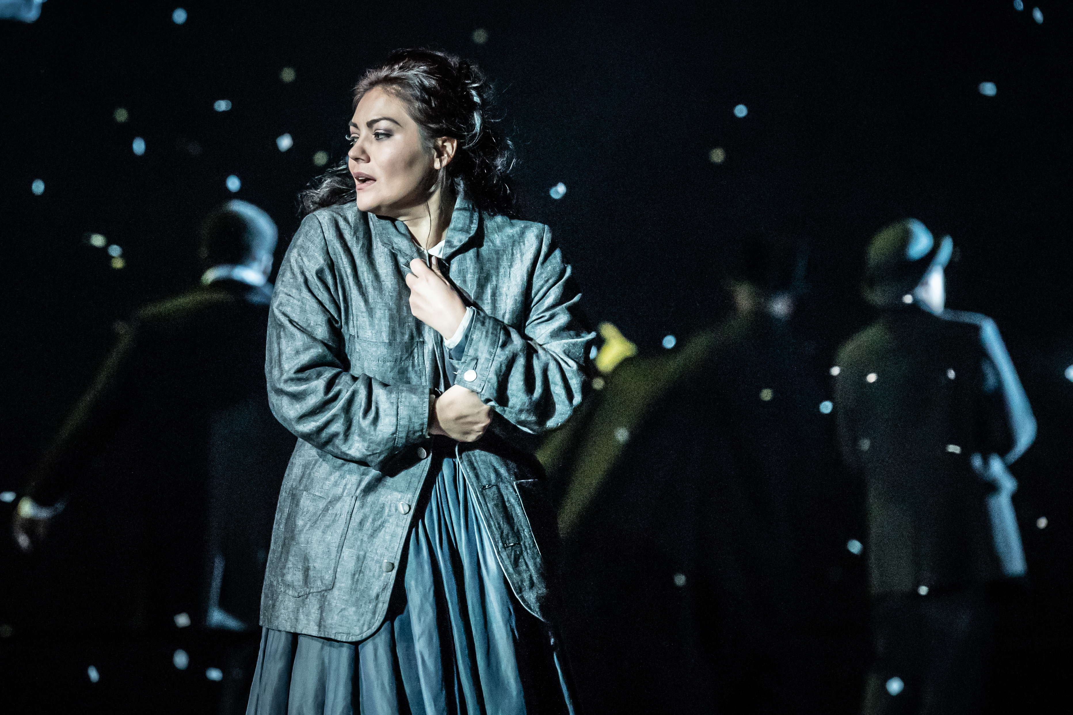 A cast member standing onstage during a performance of La bohème at the Royal Opera House.