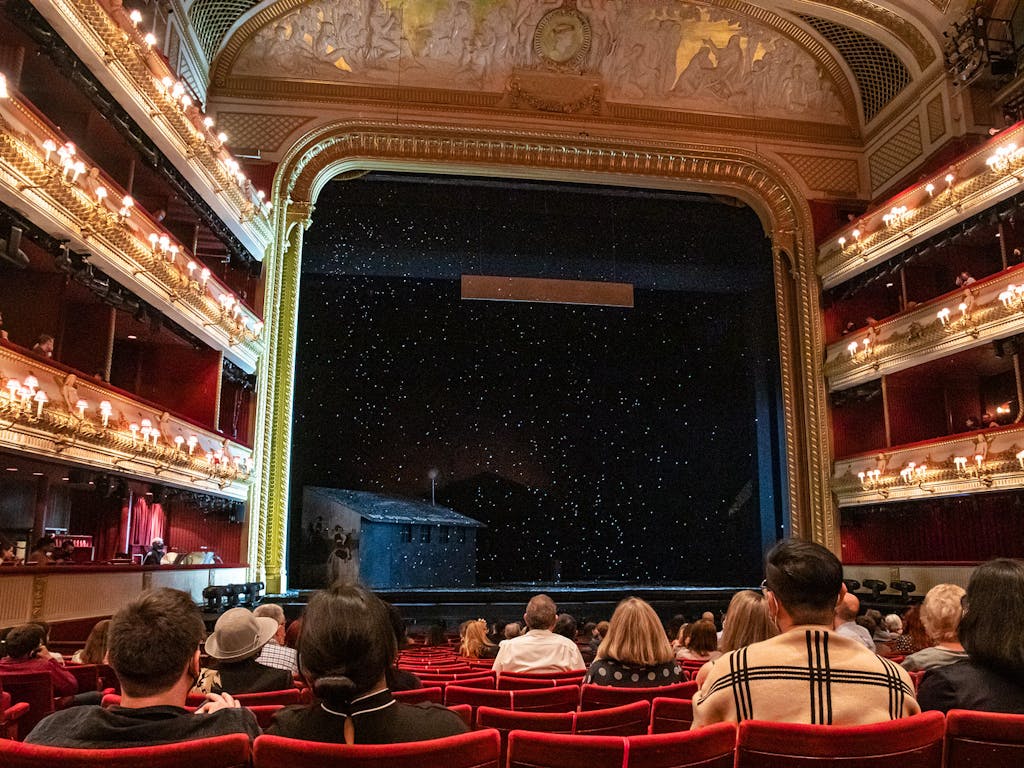 Snow falling on the main stage of the Royal Opera House during a performance.