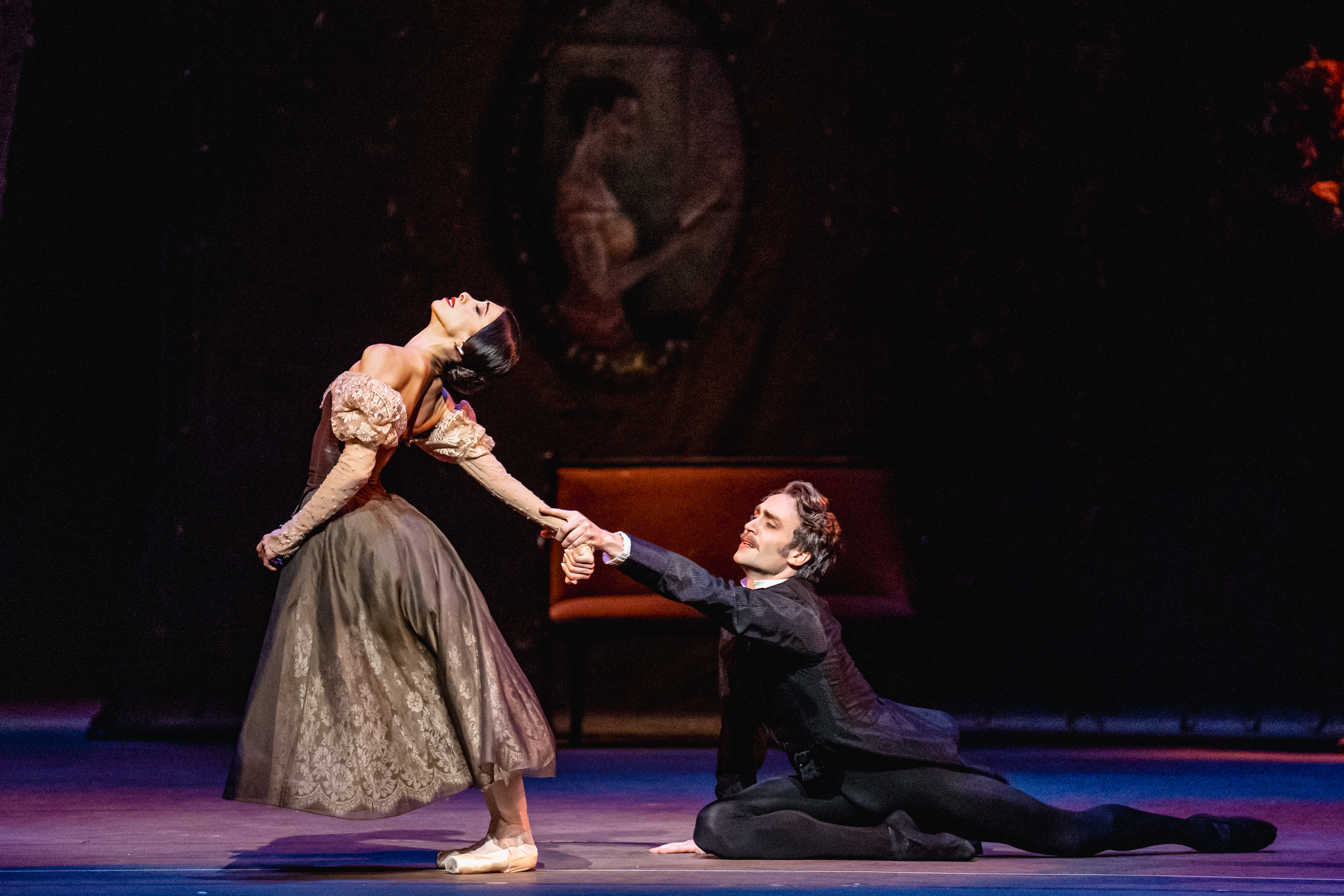 Yasmine Naghdi and Matthew Ball as Tatiana and Onegin. Onegin grasps onto Tatiana's hand in a final bid for her love, while Tatiana pulls away. 