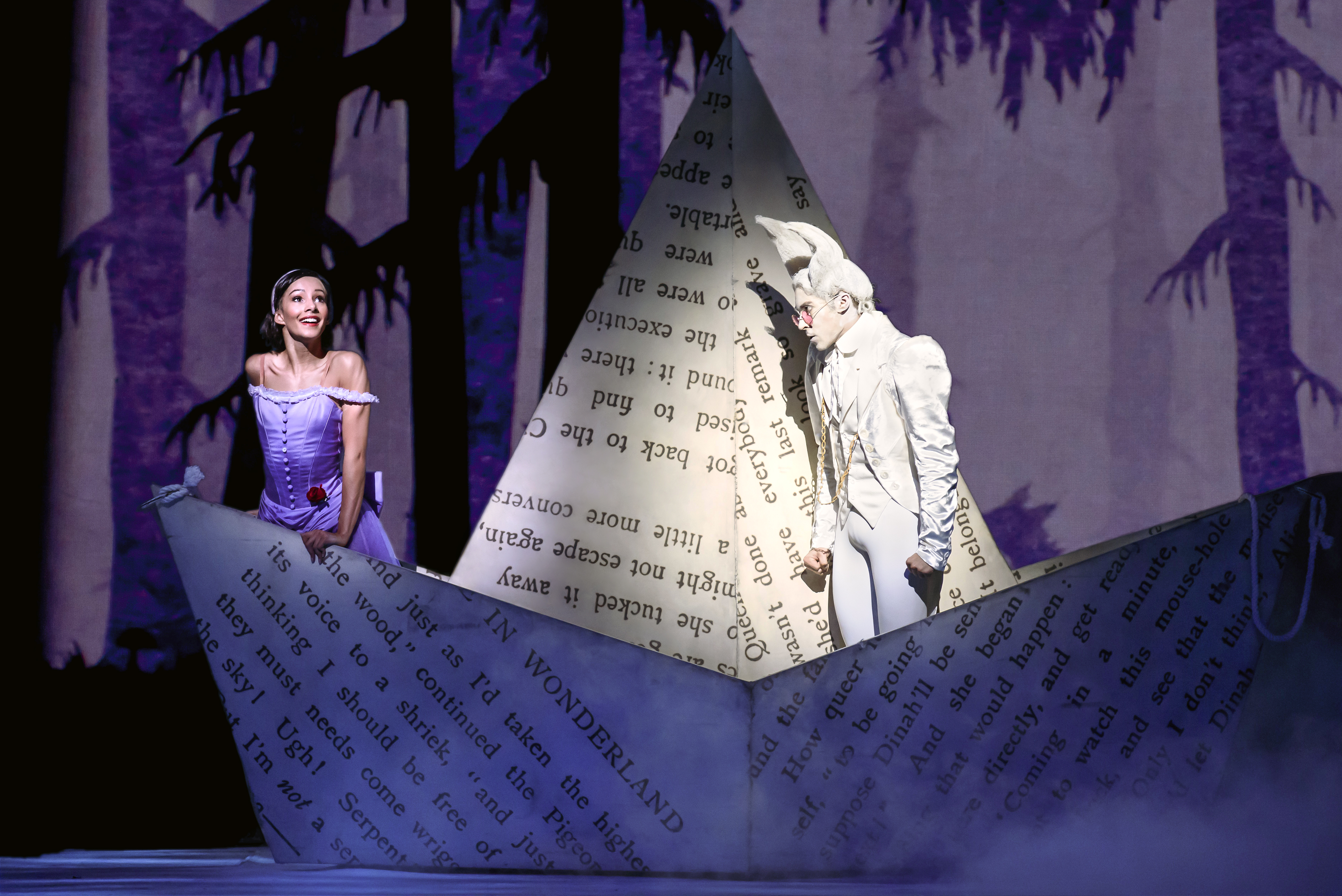 Alice and the White Rabbit stand in a boat made of paper