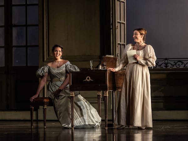 Two performers onstage at the Royal Opera House in a production of The Marriage of Figaro.