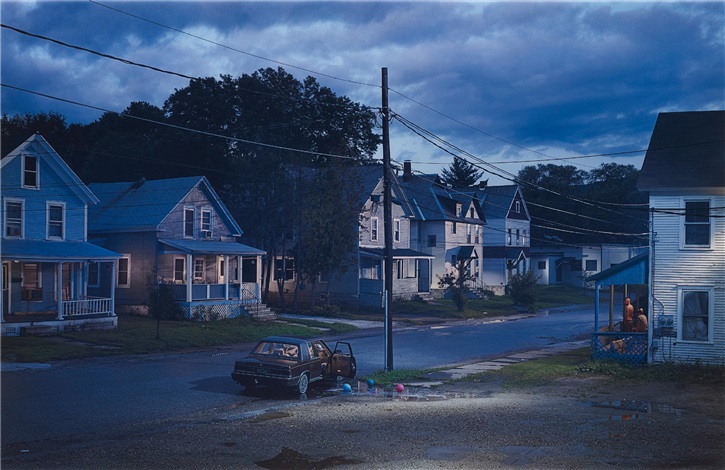 A street darkened by the changing times. Large American style houses line the streets.