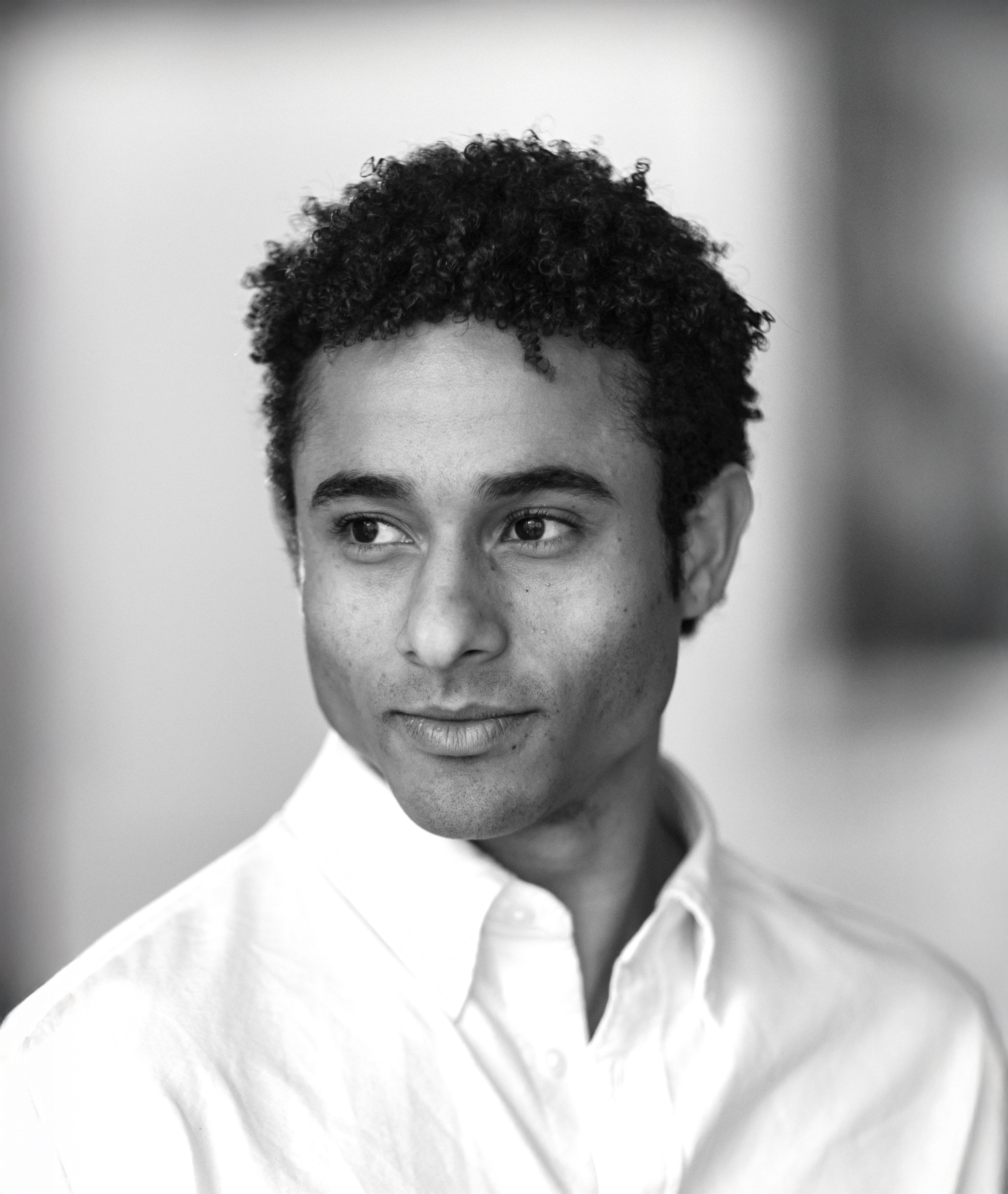 A black and white headshot of Patricio Revé