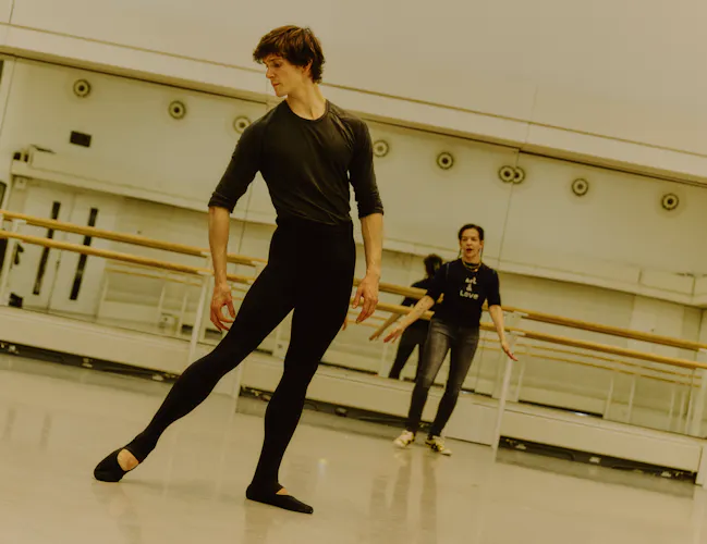 The The Royal Ballet dancer William Bracewell rehearses in a ballet studio with the choreographer Pam Tanowitz guiding him from behind. (4 of 4)