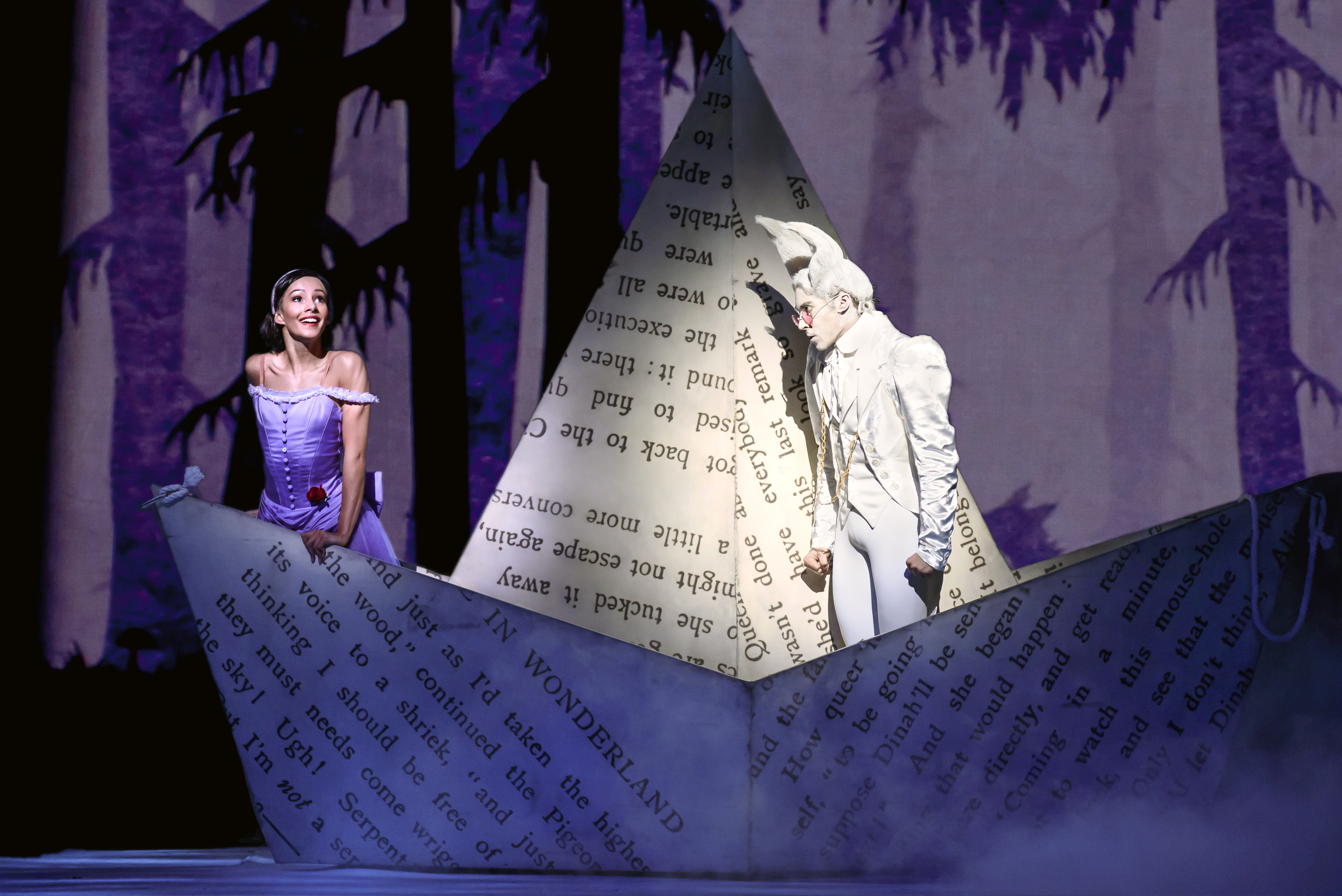 Alice and the White Rabbit stand in a boat made of paper