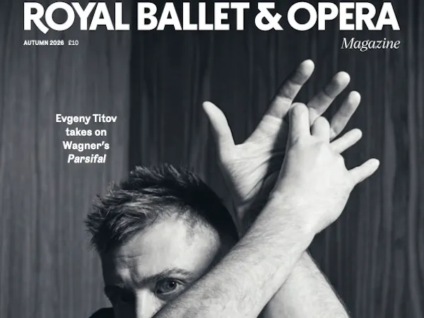 A black and white magazine cover for Royal Ballet and Opera Magazine which features a black and white photograph of a person in a black tshirt crossing their arms across their body and above their head.