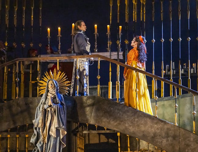 Two cast members of Tosca during a performance at the Royal Opera House.