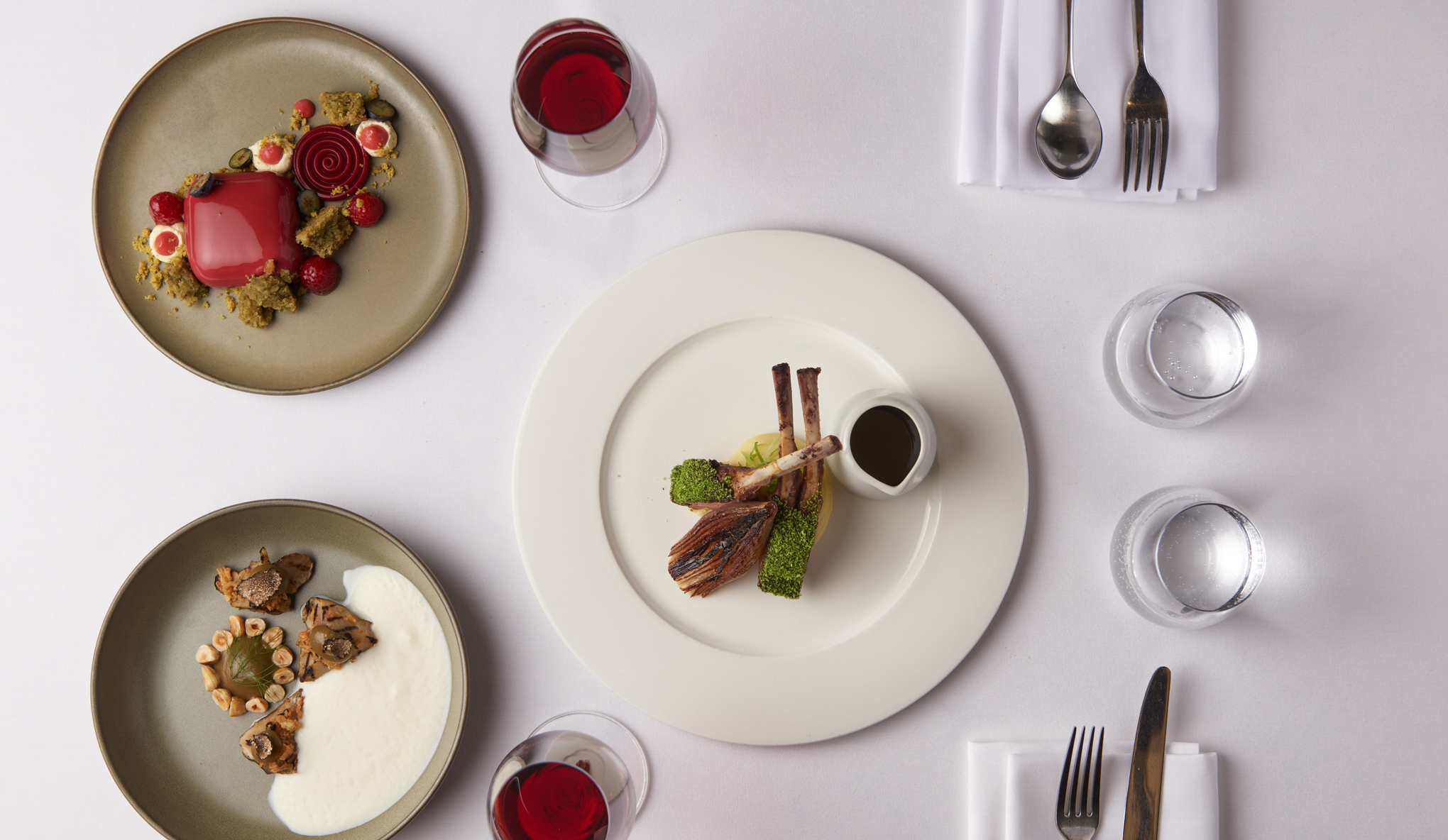 Dining tables laid out for a meal in the luxurious historic surroundings of the Crush Room.