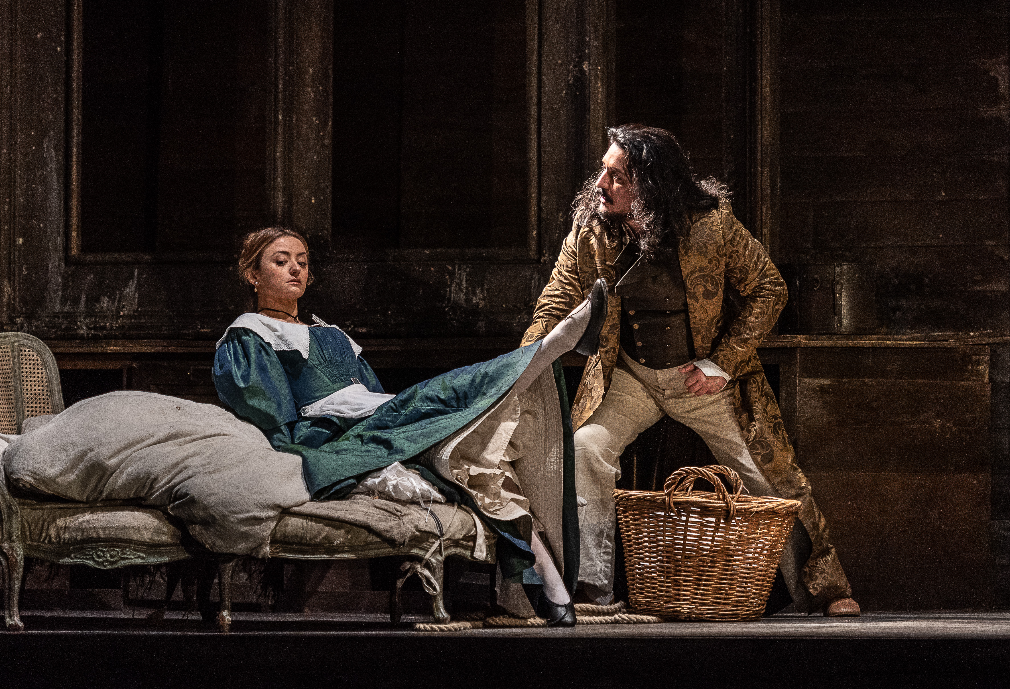 Two cast members onstage during a performance of The Marriage of Figaro. 