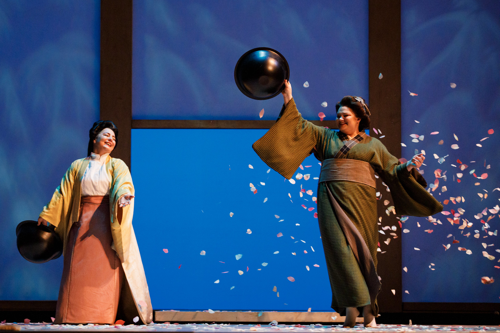 Kseniia Nikolaieva and Lianna Haroutounian throwing cherry blossoms onstage.
