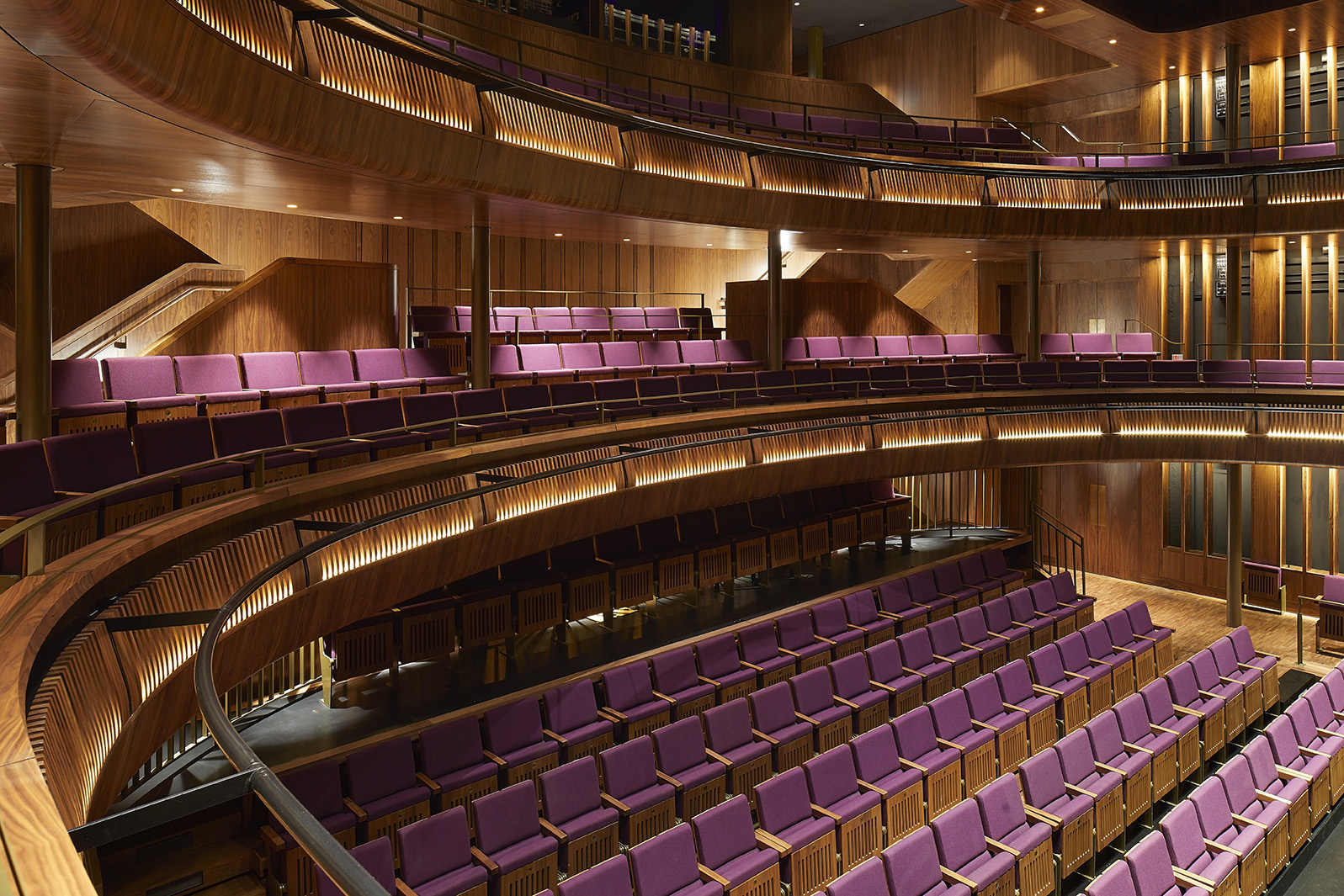 A view looking down sat the purple seating of The Linbury Theatre auditorium at the Royal Opera House.