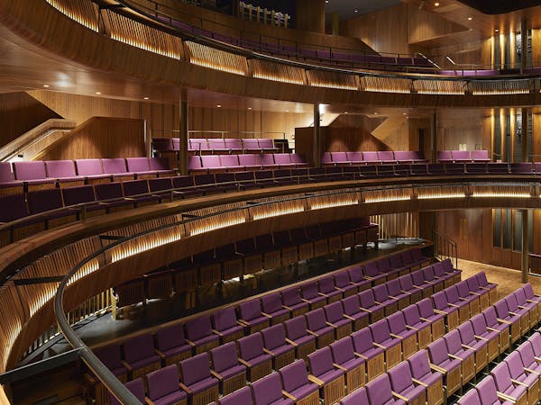 A view looking down sat the purple seating of The Linbury Theatre auditorium at the Royal Opera House.