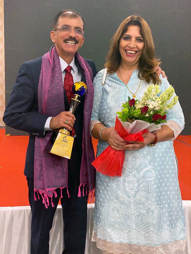 Mr. H. M. Issa and his wife gracefully celebrate receiving the esteemed 'Francis Fanthome Lifetime Achievement Award', with pride and humility.