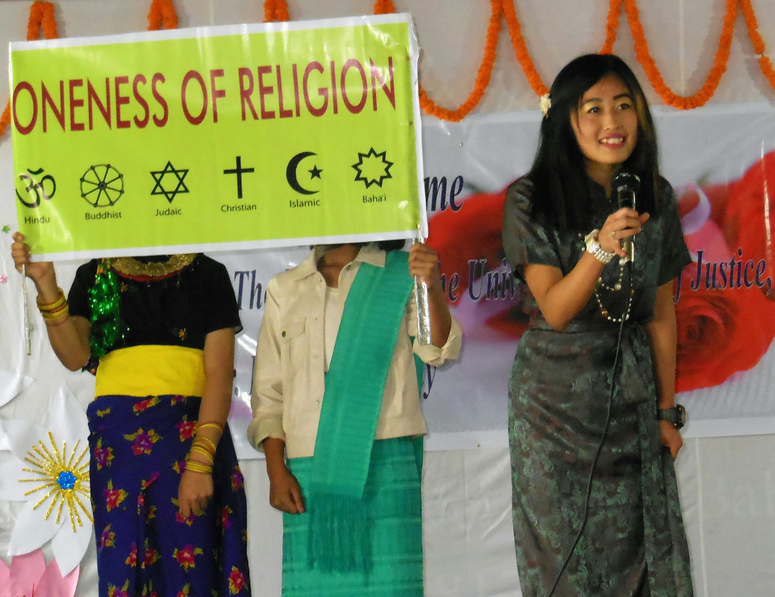 Fostering Unity: Students embrace the oneness of religion as they proudly display their message through vibrant placards.
