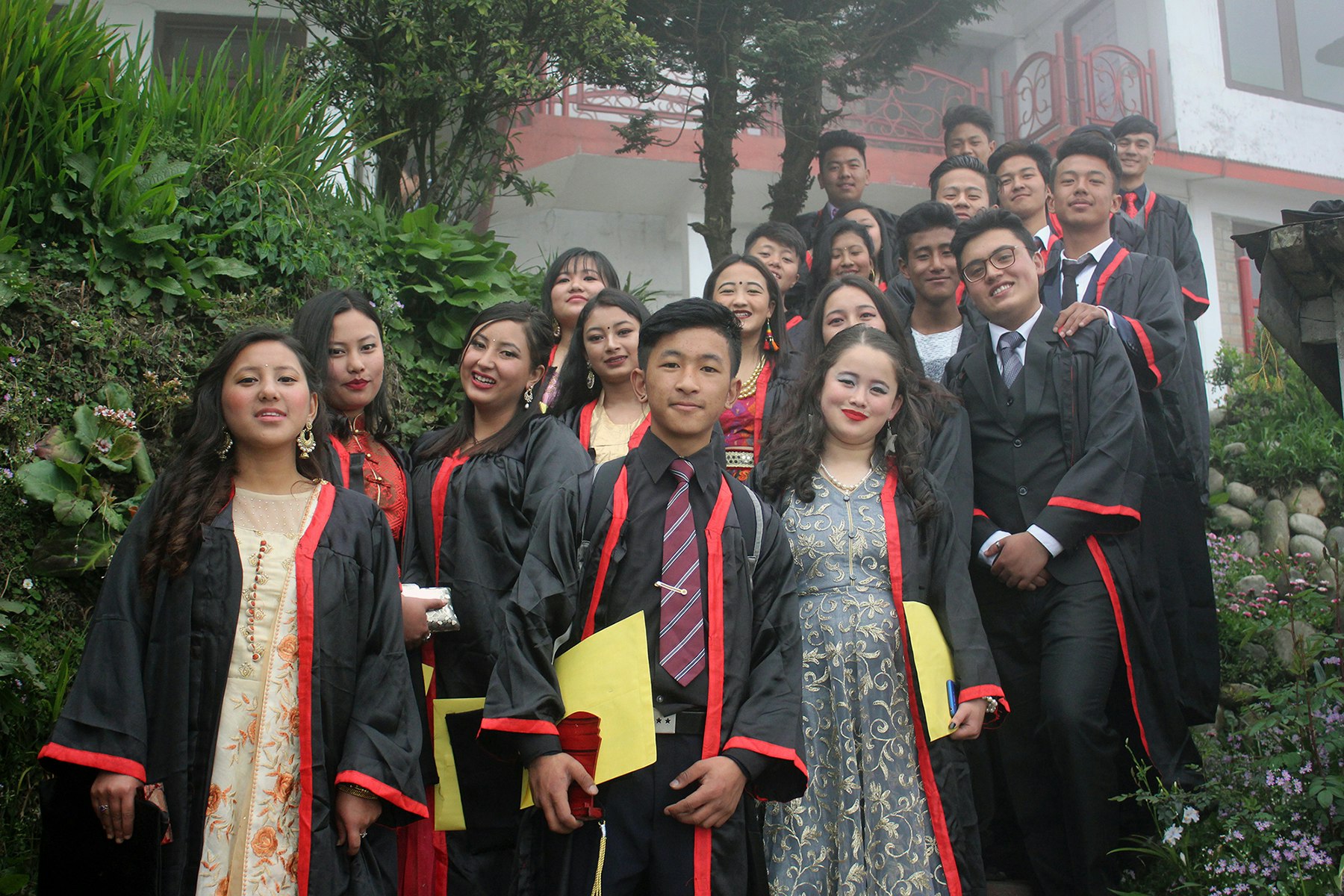 Forever cherished memories: Our radiant graduates bask in the joy of their achievements, capturing the essence of friendship, growth, and success. Surrounded by the beauty of nature and the iconic school building, they stand united, ready to embrace a promising future. Congratulations to our exceptional graduates!