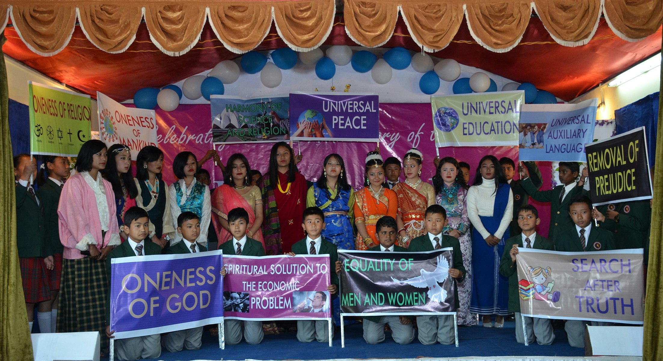 Empowered by Spiritual Principles: Students proudly showcase the essence of oneness of God, Universal education, and more through meaningful placards.