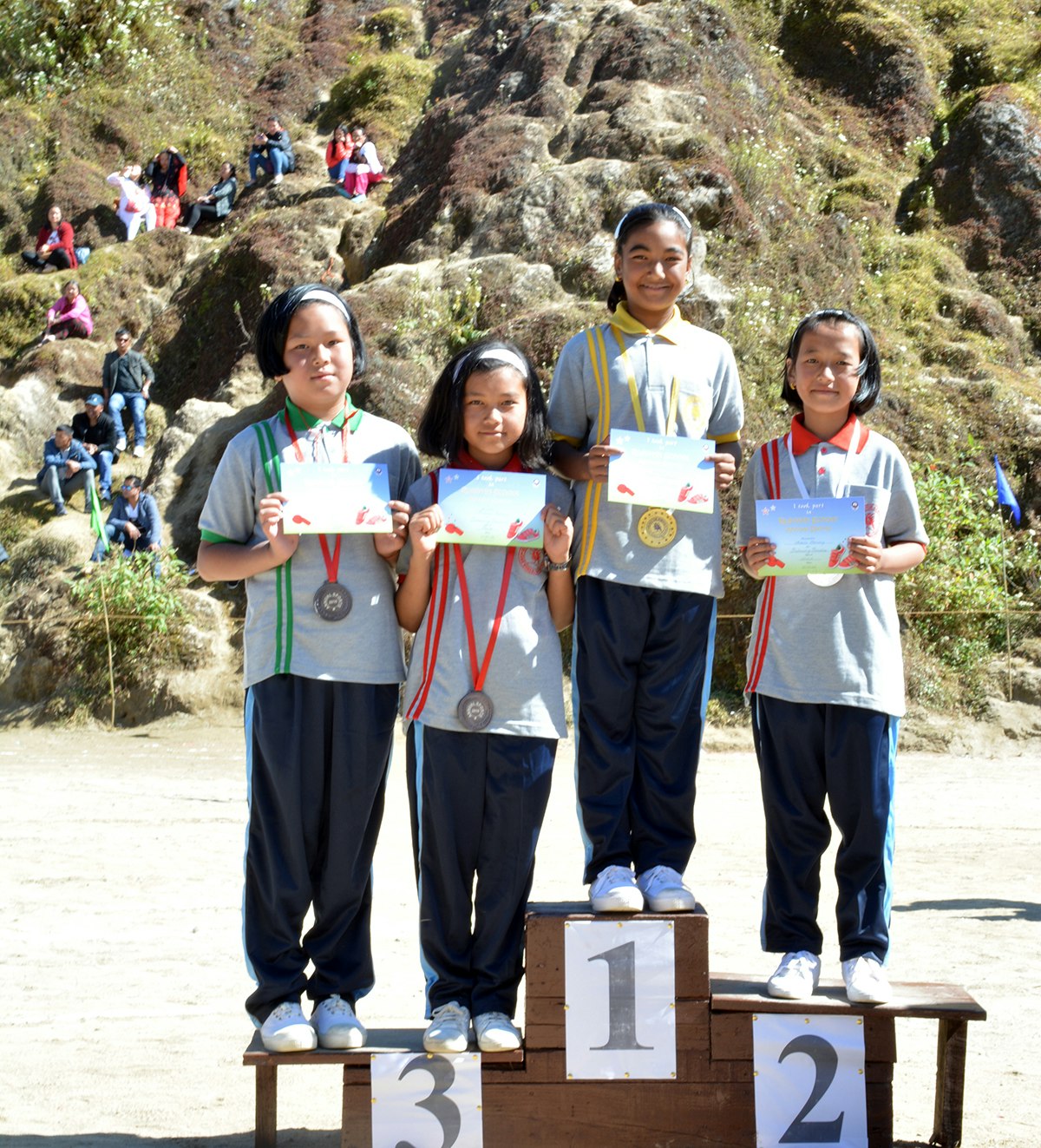 Champions on the Podium: Celebrating the remarkable achievements of our students as they proudly stand on the 1st, 2nd, and 3rd podiums. With beaming smiles, the winners proudly display their well-deserved certificates and medals, embodying the spirit of perseverance and accomplishment.