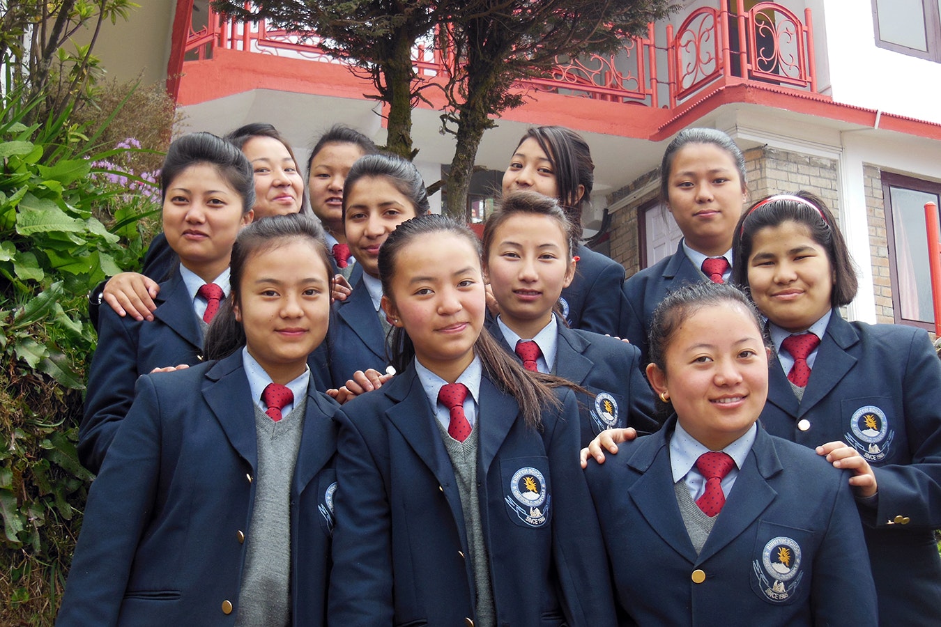 Proud and United: Grade 11 students radiate joy and togetherness as they proudly pose in their navy blue coats against the backdrop of our school's magnificent building. Their smiles reflect the spirit of camaraderie and academic excellence that define our educational community.