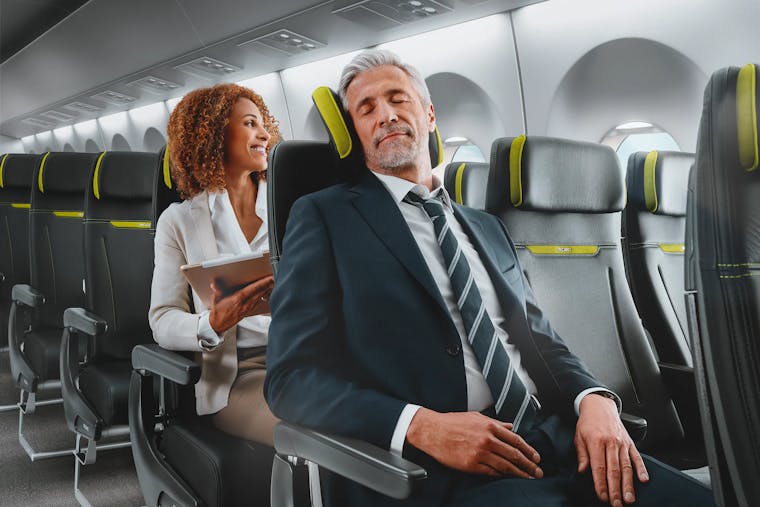 Campaign motive of Recaro: A man relaxing in airplane seats