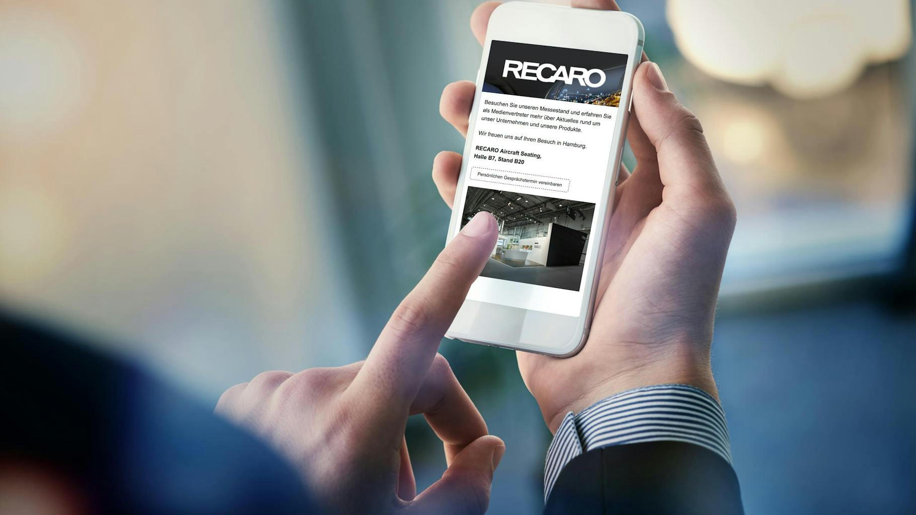 A mobile phone shows the Recaro website 