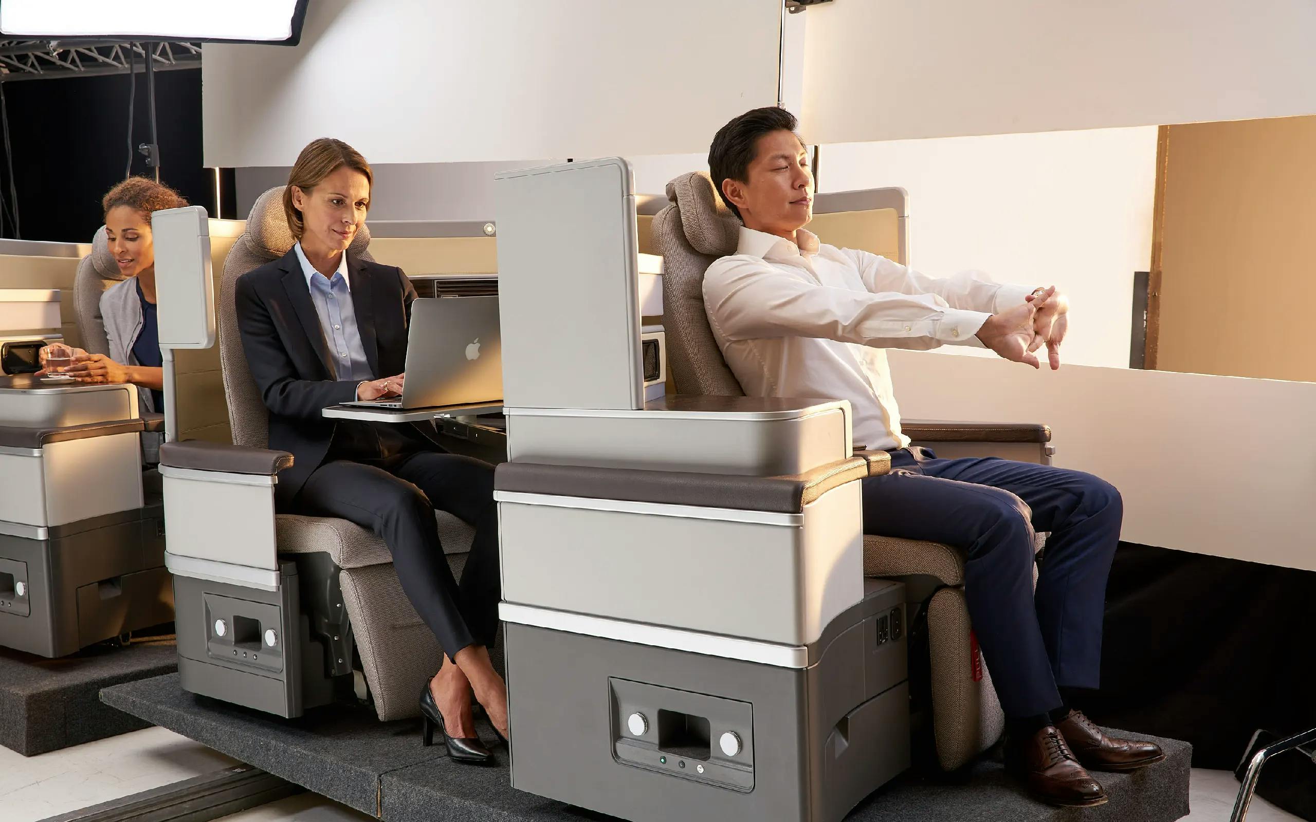 Campaign motive of Recaro: A man relaxing in airplane seats