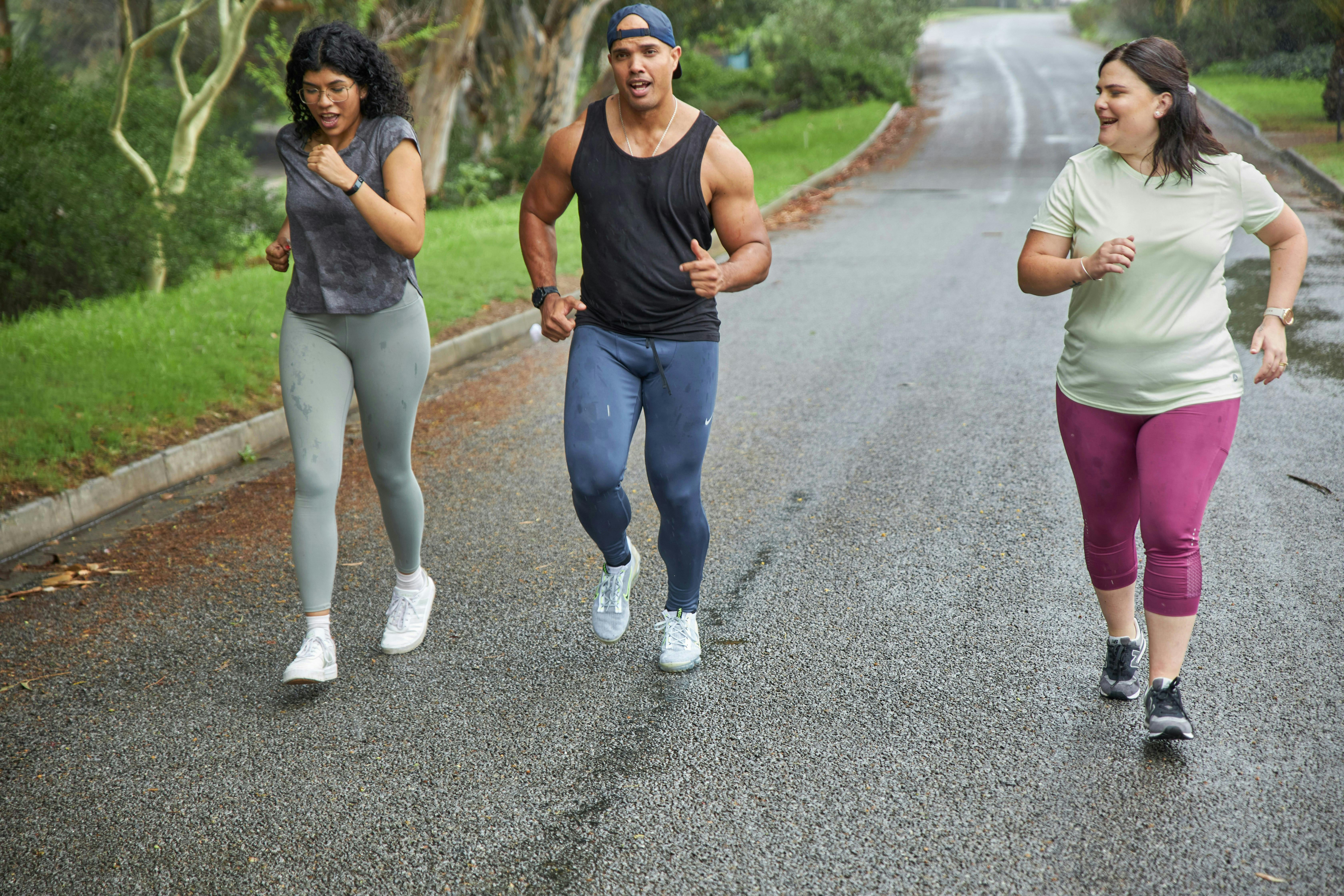 Image shows two girls and a boy running together, supporting each other
