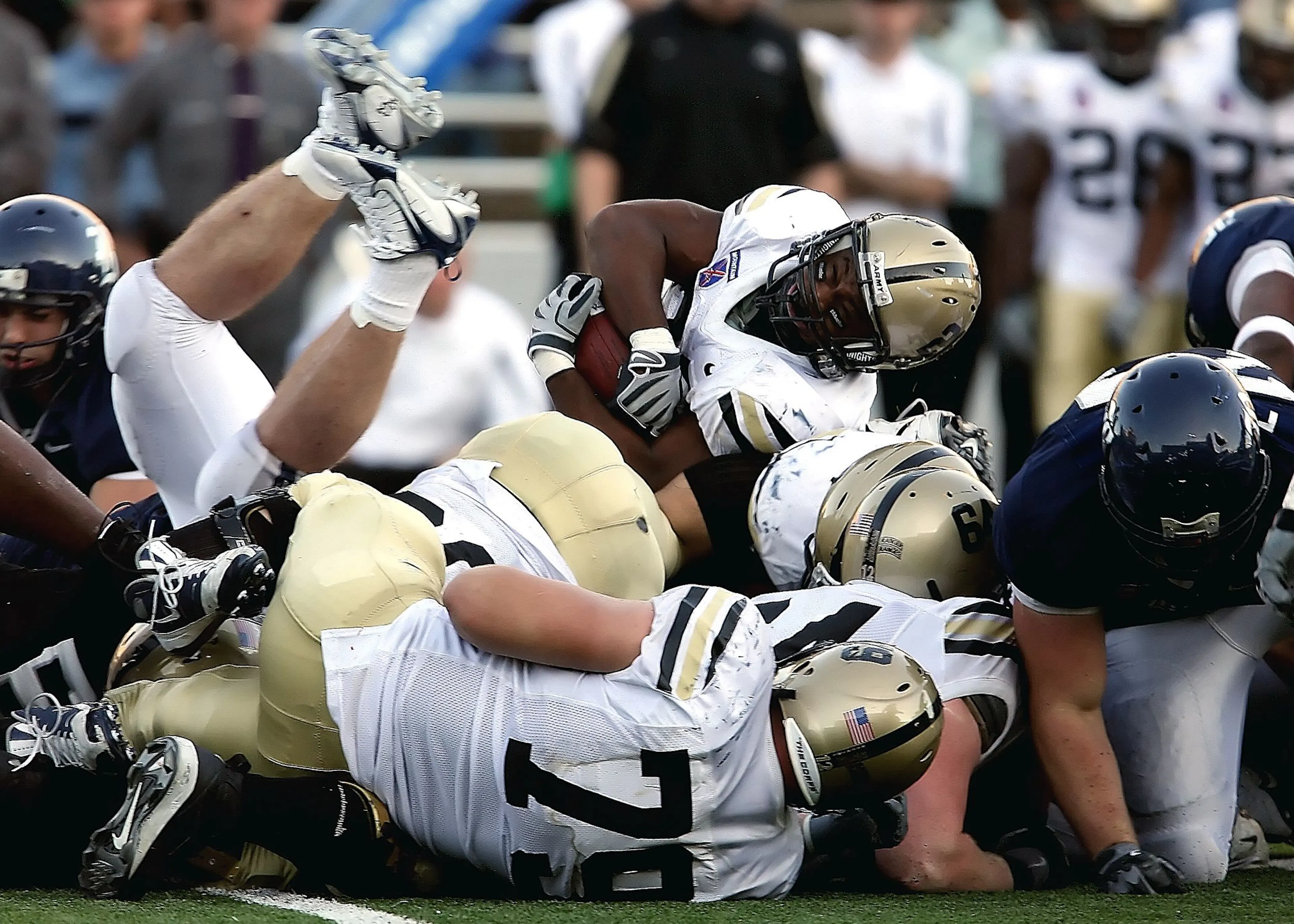 College football players in a goal-line pile