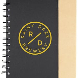 black lock-it spiral notebook with pen and yellow logo on front